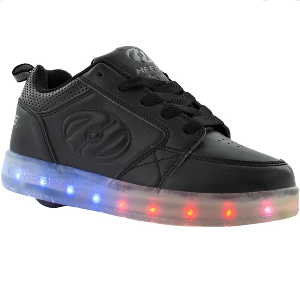 All black, light up Heelys.